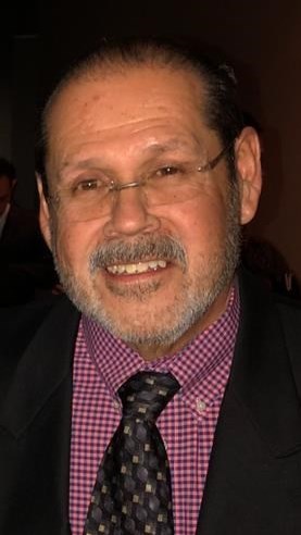 Obituary of Charles Flores Saldaña