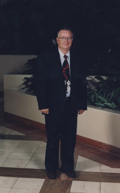 Obituary of John E. Russell