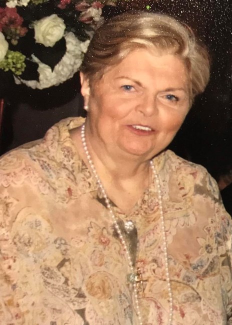 Obituary of Regina M Caroli