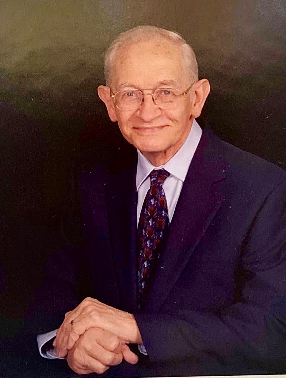 Obituary of Russell H. Poulson
